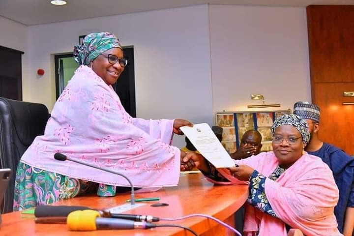 ‘Why El-Rufai Is Focusing On Human Capital Development’ 1 Deputy Governor of Kaduna state, Dr Hadiza Balarabe, presenting a copy of Oath of Office to Hajiya Ummah K Ahmad, after being sworn in as Commissioner of Local Government Affairs, along with five other political appointees, at the Council Chambers of Sir Kashim Ibrahim House