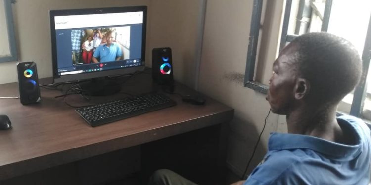 A sick patient being attended to using telemedicine channel in Benin City, Edo State.