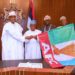 Osun Guber: Buhari Presents APC Flag To Oyetola