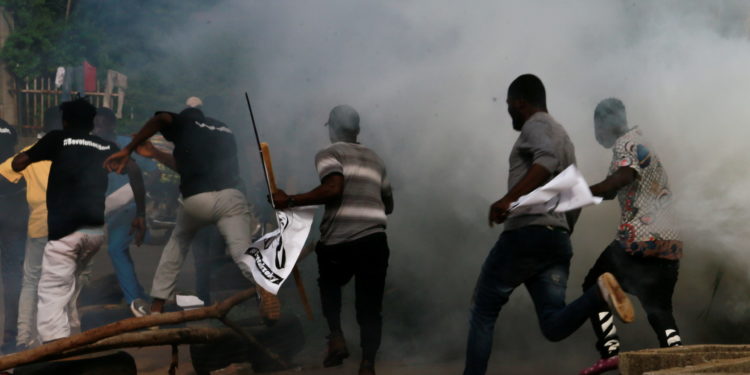 Pic Credit - Protesters run after police fired teargas during a June 12 Democracy Day rally in Abuja, Nigeria June 12, 2021. REUTERS/Afolabi Sotunde
