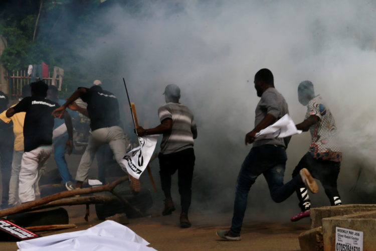 Pic Credit - Protesters run after police fired teargas during a June 12 Democracy Day rally in Abuja, Nigeria June 12, 2021. REUTERS/Afolabi Sotunde