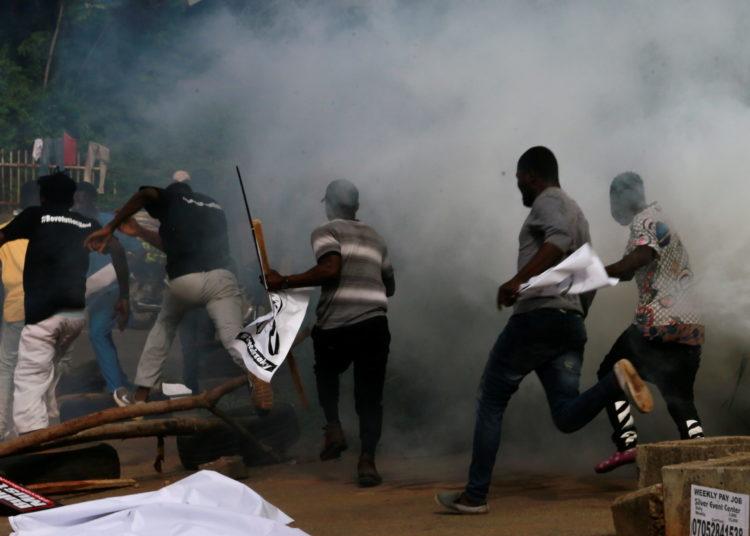 Pic Credit - Protesters run after police fired teargas during a June 12 Democracy Day rally in Abuja, Nigeria June 12, 2021. REUTERS/Afolabi Sotunde