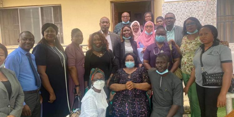 Founder, Amazing Grace Foundation, Chief Ifeyinwa Obegolu (wearing a face mask) flanked by members of the Mental and Dental Consultants Association of Nigeria (MDCAN), FMC Abuja, during a medical outreach to the Home in Abuja.