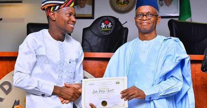 Governor Nasir El-Rufai presenting a certificate to Mr Dada Olateju Yusuff who emerged the best graduating Fellow of the 4th Cohort of the Sir Kashim Ibrahim Fellowship