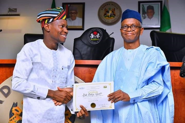 Governor Nasir El-Rufai presenting a certificate to Mr Dada Olateju Yusuff who emerged the best graduating Fellow of the 4th Cohort of the Sir Kashim Ibrahim Fellowship