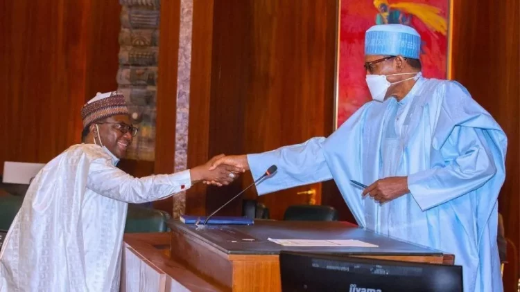 The new chairman, Revenue Mobilisation Allocation and Fiscal Commission, (RMAFC), Mohammed Bello Shehu and President Muhammadu Buhari during swearing-in of the new chairman of RMAFC at the Presidential Villa Abuja, yesterday.