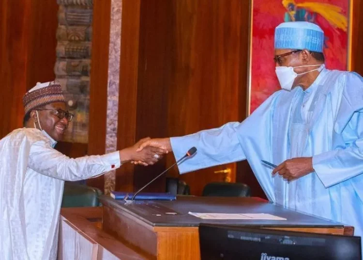 The new chairman, Revenue Mobilisation Allocation and Fiscal Commission, (RMAFC), Mohammed Bello Shehu and President Muhammadu Buhari during swearing-in of the new chairman of RMAFC at the Presidential Villa Abuja, yesterday.