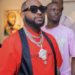 Davido Shares Dollars To Fans, Workers At Lagos Airport