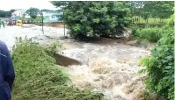 Motorists, Commuters Groan As Flood Overflows Bridge In Oyo