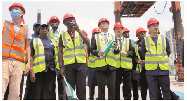 Sanwo-Olu Vows To Test Run Lagos Blue Rail Line Trains In December 1 L-R: CCECC projects manager, John Zhang; managing director, Lagos Metropolitan Area Transport Authority (LAMATA), Engr. Abimbola Akinajo; commissioner for Transport, Fredric Oladehinde; Governor Babajide Sanwo-Olu of Lagos State; chairman, CCECC Worldwide, Liu Win Min; managing director, CCECC Nigeria, David Wang and chairman, CCECC Nigeria, Zhang Zhichen and others, during the Final Beam Launch of the Blue Line Rail Bridge in Lagos,yesterday. PHOTO BY KOLAWOLE ALIU