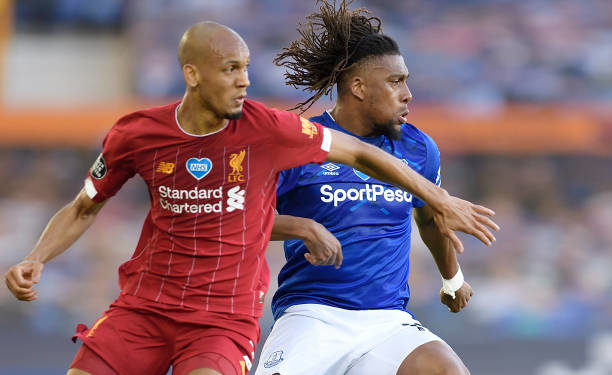LIVERPOOL, ENGLAND - JUNE 21:  Alex Iwobi of Everton and Fabinho (L) during the Premier League match between Everton and Liverpool at Goodison Park on June 21 2020 in Liverpool, England. (Photo by Tony McArdle/Everton FC via Getty Images)