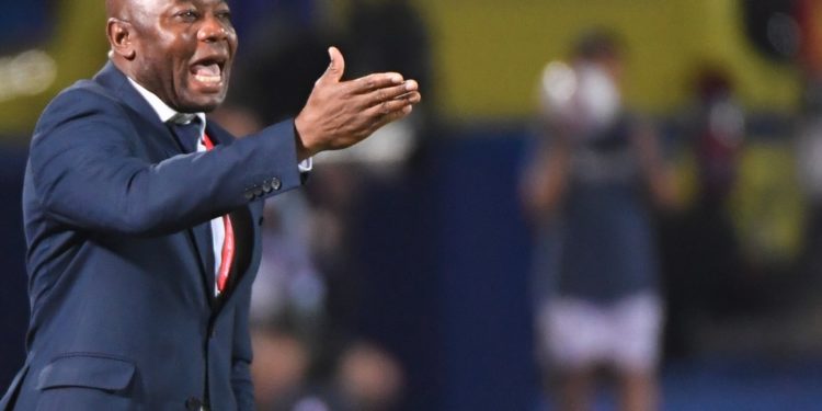 Tanzania's coach Emmanuel Amunike reacts during the 2019 Africa Cup of Nations (CAN) football match between Senegal and Tanzania at the 30 June Stadium in Cairo on June 23, 2019. (Photo by Khaled DESOUKI / AFP)