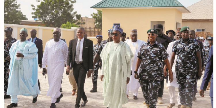 Governor Aminu Bello Masari (middle) alongside Inspector General of Police, Alkali Idris Baba during the commissioning of Zone 14 Police Headquarters in Katsina State.