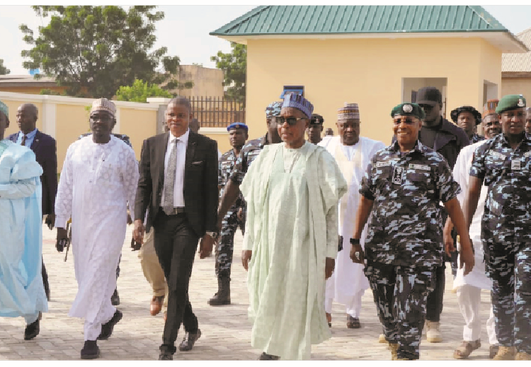 Governor Aminu Bello Masari (middle) alongside Inspector General of Police, Alkali Idris Baba during the commissioning of Zone 14 Police Headquarters in Katsina State.