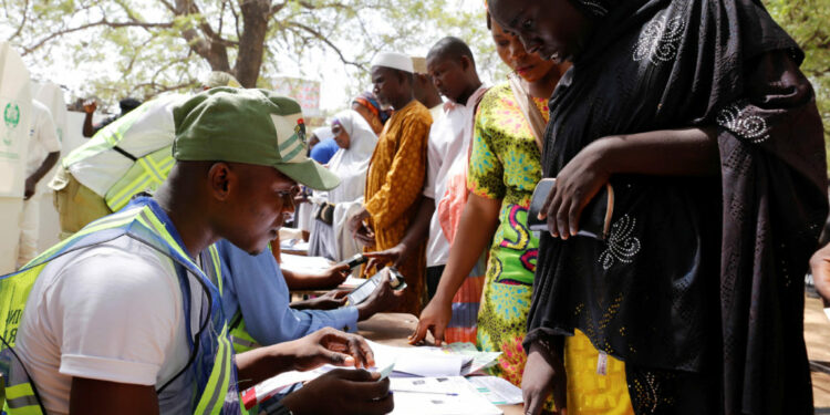 People arrive to cast their votes during Nigeria's presidential election at a polling station in Yola, Adamawa State, Nigeria February 23, 2019.      REUTERS/Nyancho NwaNri - RC1B303BF090