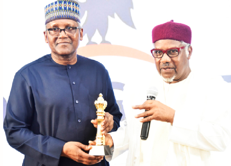 L-R: President, Dangote Industries Ltd, and guest lecturer, Aliko Dangote receiving an award from the president, Manufacturers Association of Nigeria (MAN), Engr. Mansur Ahmed, during MAN’s 50th Annual General Meeting (AGM) and Second Adeola Odutola Lecture and Presidential Luncheon in Lagos recently.