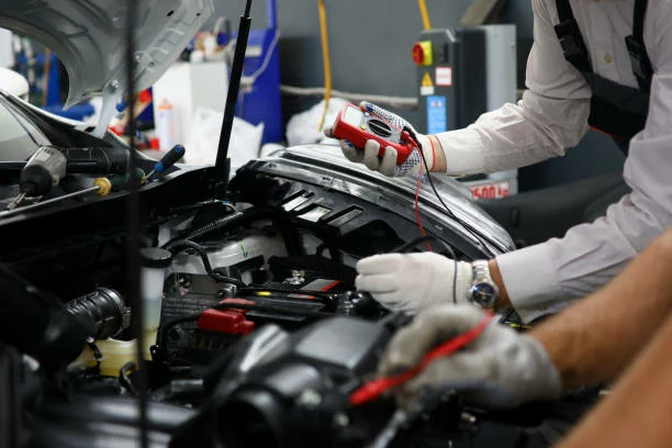 Making Extra Cash From Working As An Auto Electrician 1 Two specialists of service for repairing wiring and computer diagnostics car solve problem engine malfunction. Serviceman collaborate education training concept. New technology studyng