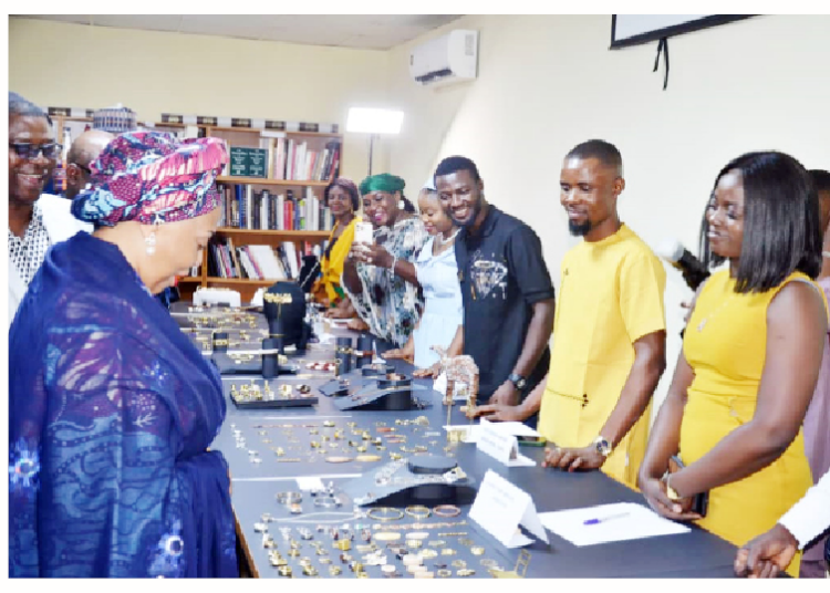 Minister of State for Mines and Steel Development, Senator Gbemi Saraki, inspecting jewellery items produced by the graduating class of trainees