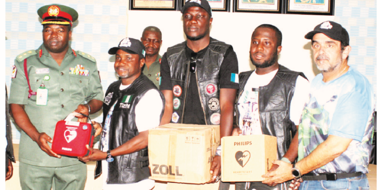 L-R, Acting chief medical director, 44 Army Reference Hospital, Kaduna, Col Ndidi Stephen Onuchukwu; president, Jeje Riders Association of Bikers, Tishe Ibrahim  Mathew; a member of the association of Bikers,  Husaini Misari; treasurer, Surajo Musa, and a member of FUN Bikers of Nigeria, Heuman Lababidi, during the presentation of equipment to the hospital by the Jeje Riders Association of Bikers in Kaduna yesterday Photo Gbenga Folorunsho Abiola.