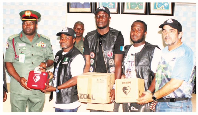 L-R, Acting chief medical director, 44 Army Reference Hospital, Kaduna, Col Ndidi Stephen Onuchukwu; president, Jeje Riders Association of Bikers, Tishe Ibrahim  Mathew; a member of the association of Bikers,  Husaini Misari; treasurer, Surajo Musa, and a member of FUN Bikers of Nigeria, Heuman Lababidi, during the presentation of equipment to the hospital by the Jeje Riders Association of Bikers in Kaduna yesterday Photo Gbenga Folorunsho Abiola.