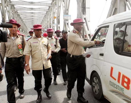 Cannabis And Driving Don’t Mix 1 PIC. 24. CORPS MARSHAL, FRSC, MR OSITA CHIDOKA (R), OFFICERS AND MEN OF THE CORPS, DISTRIBUTING LEAFLETS WITH ROAD SAFETY MESSAGES TO MOTORISTS ON THE RIVER NIGER BIDGE IN ONITSHA , ANAMBRA ON WEDNESDAY (1/1/14).