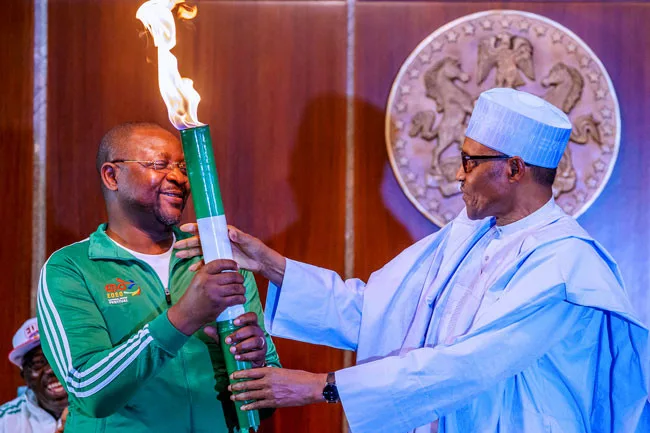 Buhari and Sunday Dare Lights Torch National Sport Festival 1 jpg