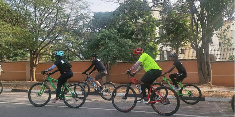 A Chaingang cyclist group moves through a route in the Maitama district of Abuja, Nigeria's capital city