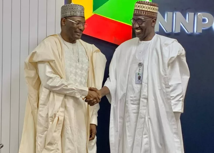 L-R: INEC chairman, Prof. Mahmood Yakubu, and GCEO of NNPCL, Engr. Mele Kyari, during a visit by INEC management to NNPCL headquarters in Abuja, on Tuesday.