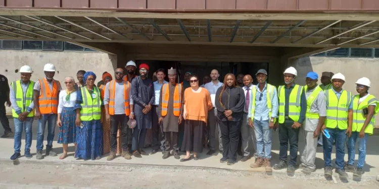 French Ambassador to Nigeria, Ms Emmanuelle Blatmann (centre), in a group photograph with Kwara State government officials, during her visit to the ongoing Visual Arts Centre project in Ilorin, the State capital. Photo by Abdullahi Olesin.