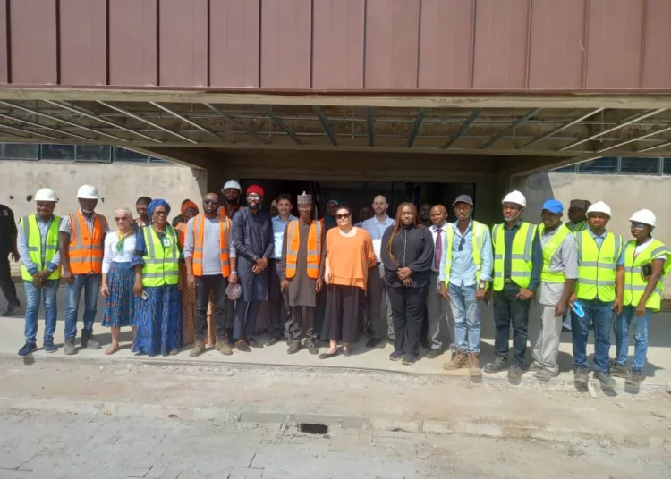 French Ambassador to Nigeria, Ms Emmanuelle Blatmann (centre), in a group photograph with Kwara State government officials, during her visit to the ongoing Visual Arts Centre project in Ilorin, the State capital. Photo by Abdullahi Olesin.