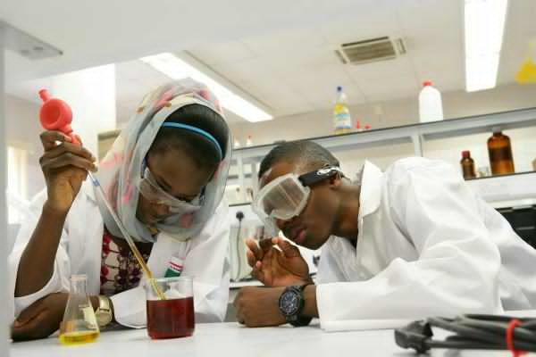PSN Canvasses Special Workforce To Train Pharmacy Students 1 Nigerian university students in laboratory