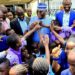 Excited Abuja School Children ‘Mob’ Atiku At Airport