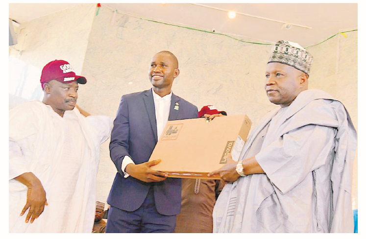 Road Transport Workers Endorse Governor Inuwa For 2nd Term 1 Gombe State governor, Muhammadu Inuwa Yahaya (right), making a symbolic presentation of a computer laptop to one of the 30 law students of Gombe State origin, while the state's attorney-general and commissioner for Justice, Barr Zubair Umar, looks on during a solidarity visit by Gombe State Students Association in Gombe, yesterday.