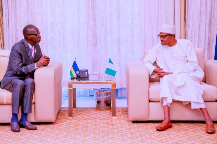 L-R: Outgoing Rwandan High Commissioner to Nigeria, Stanislas Kamanzi, and President Muhammadu Buhari, during the diplomat's farewell visit.