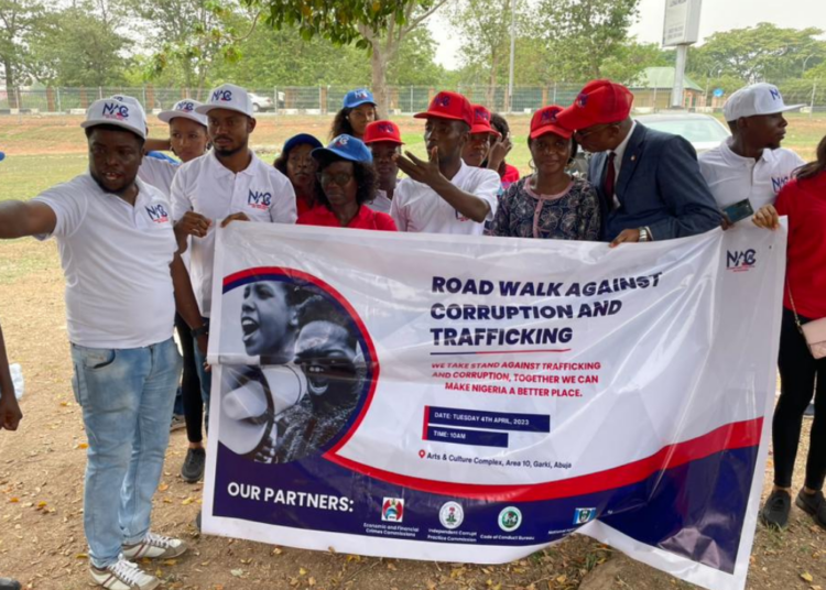 Mr. Tony Orilade, Head, Public Interface Unit, EFCC (m); Mrs. Ese Okwong, Assistant Director, Public Elightenment and Education Dept, EFCC, and members of NACAT during the walk against corruption in Abuja, on Tuesday.