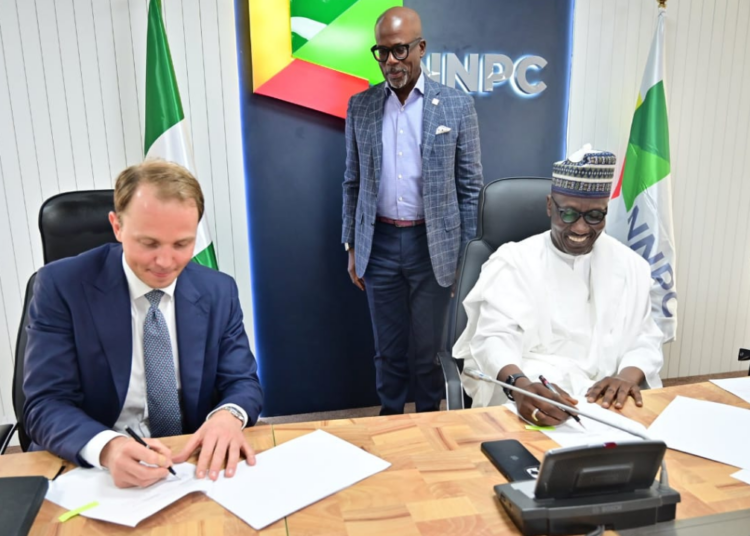 R-L: Group CEO of NNPCL, Mele Kyari, and CEO of Golar LNG, Karl Fredrik Staubo, during the MoU signing in Abuja.