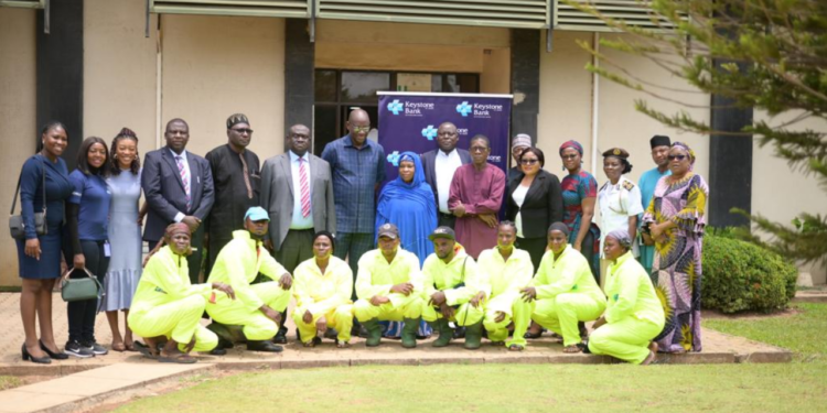 AEPB director, Engr. Osilamah Braimah, officials of AEPB, and representatives of Keystone Bank Ltd, during the presentation of protective garments by the Bank to AEPB at its office in Abuja, recently.
