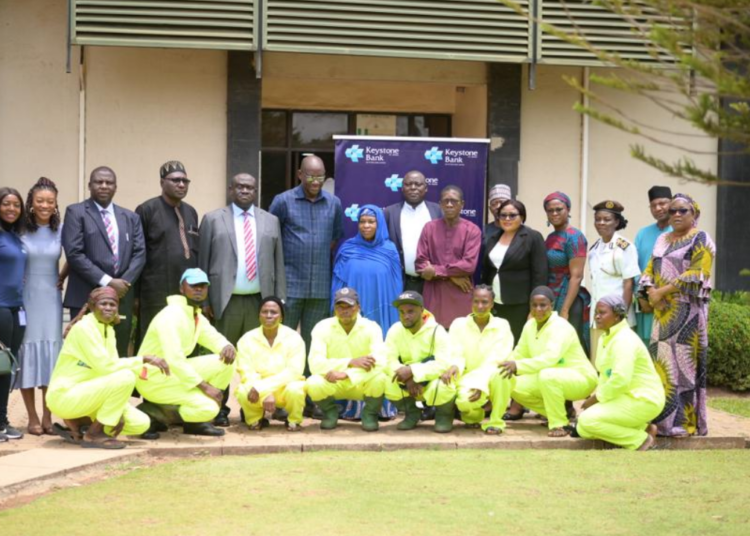 AEPB director, Engr. Osilamah Braimah, officials of AEPB, and representatives of Keystone Bank Ltd, during the presentation of protective garments by the Bank to AEPB at its office in Abuja, recently.