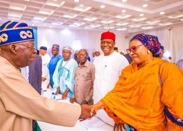 L-R: President Bola Tinubu exchanging pleasantries with a former chairman of LEADERSHIP Newspapers Group and now Senator-elect for FCT, Heebah Ireti Kingibe, during the President's meeting with all federal lawmakers-elect at the State House, Abuja, on Thursday.