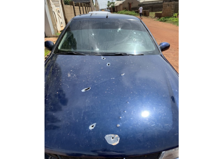 The bullet-ridden car of a victim of the attack. Photo By Isaiah Benjamin