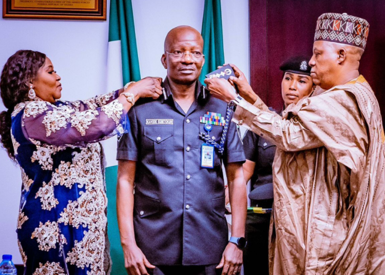 Vice President Senator Kashim Shettima (GCON), decorates the new Acting Inspector-General of Police, Kayode Egbetokun at the State House, Abuja.  #VillaToday