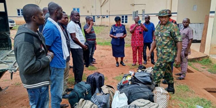 Military officials hand over suspects and exhibits at the Nigeria Security and Civil Defense Corps, NSCDC office, Asaba. Photo: Felix lgbekoyi