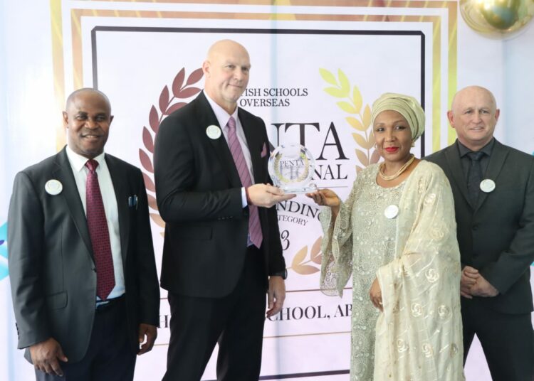 L-R: Head of Assessments, Mr. Akin Alufa; Headmaster, Mr. Joe Labuschagne; Proprietress, Mrs. Amsa AbdulRazaq; Senior Teacher, Mr. Joe Dyer, at the presentation of the BSO inspection report that awarded The Regent School, Abuja outstanding in all categories.