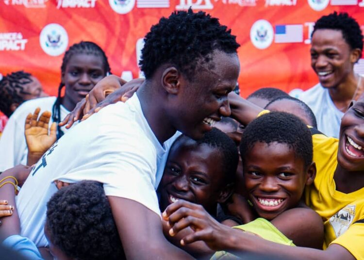 Dancing to connect workshop participant connecting and dancing with the Children of Garki Village.