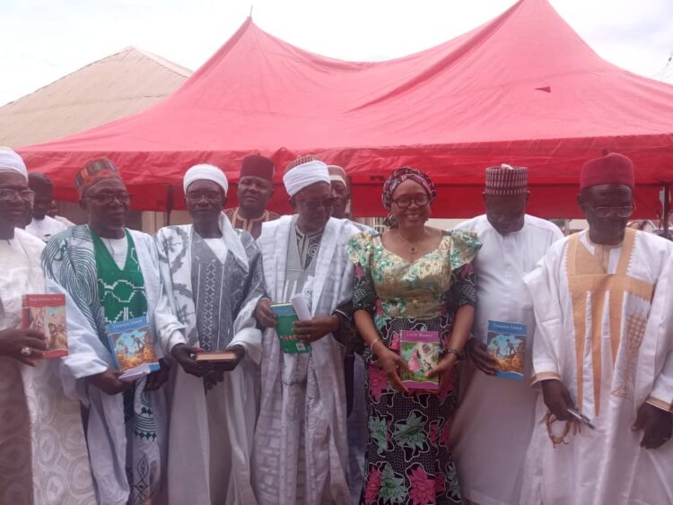 The National Librarian and CEO National Library of Nigeria (NLN), Professor Chinwe Veronica Anunobi, with the traditional leader of the Karshi Community, Abuja, at the outreach programme of the library marking the International Literacy Day recently.
