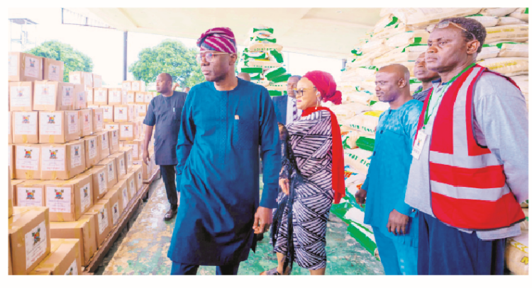 Governor of Lagos State Babajide Sanwo-Olu inspecting the foodboxes and packs during the official flag-off of the Lagos State government foodbank p-rogramme, as part of the palliative measures to mitigate the effect offuel subsidy removal, at the Lagos House, Alausa, Ikeja,in Lagos.PHOTO BY KOLAWOLE ALIU