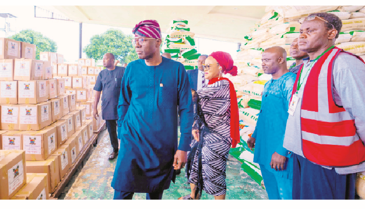 Governor of Lagos State Babajide Sanwo-Olu inspecting the foodboxes and packs during the official flag-off of the Lagos State government foodbank p-rogramme, as part of the palliative measures to mitigate the effect offuel subsidy removal, at the Lagos House, Alausa, Ikeja,in Lagos.PHOTO BY KOLAWOLE ALIU