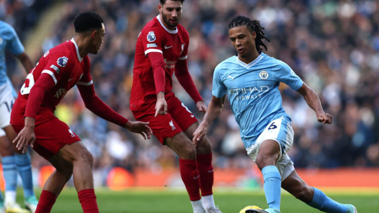 Liverpool's English defender #66 Trent Alexander-Arnold (L) vies with Manchester City's Dutch defender #06 Nathan Ake during the English Premier League football match between Manchester City and Liverpool at the Etihad Stadium in Manchester, north west England, on November 25, 2023. (Photo by Darren Staples / AFP) / RESTRICTED TO EDITORIAL USE. NO USE WITH UNAUTHORIZED AUDIO, VIDEO, DATA, FIXTURE LISTS, CLUB/LEAGUE LOGOS OR 'LIVE' SERVICES. ONLINE IN-MATCH USE LIMITED TO 120 IMAGES. AN ADDITIONAL 40 IMAGES MAY BE USED IN EXTRA TIME. NO VIDEO EMULATION. SOCIAL MEDIA IN-MATCH USE LIMITED TO 120 IMAGES. AN ADDITIONAL 40 IMAGES MAY BE USED IN EXTRA TIME. NO USE IN BETTING PUBLICATIONS, GAMES OR SINGLE CLUB/LEAGUE/PLAYER PUBLICATIONS. - RESTRICTED TO EDITORIAL USE. No use with unauthorized audio, video, data, fixture lists, club/league logos or 'live' services. Online in-match use limited to 120 images. An additional 40 images may be used in extra time. No video emulation. Social media in-match use limited to 120 images. An additional 40 images may be used in extra time. No use in betting publications, games or single club/league/player publications. /