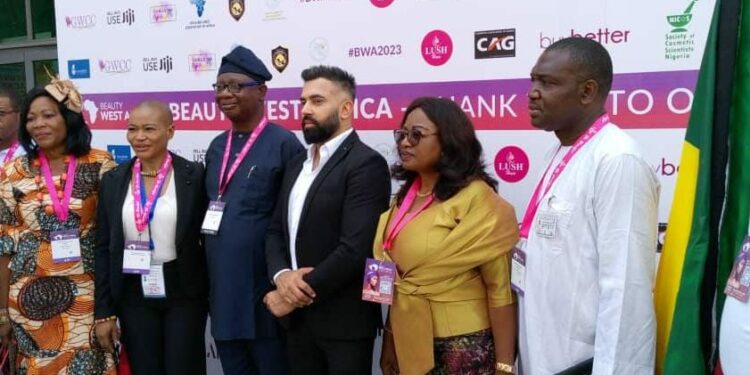 NACCIMA DG, Shola Obadimu (3rd from left), with participants at the exhibition.
