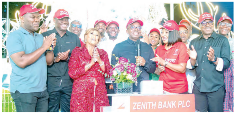 The group managing director/CEO of Zenith Bank Plc, Dr. Ebenezer Onyeagwu (4th Left) flanked by the wife of the Founder and Chairman of Zenith Bank Plc, Mrs. Kay Ovia (3rd Left); executive Director, Mr. Henry Oroh (1st Left); executive director, Dr. Temitope Fasoranti (2nd Left); executive director, Mrs Adobi Nwapa (2nd Right); and executive director, Mr. Akin Ogunranti (1st Right) at the 2023 Zenith Bank Christmas Light-Up of Ajose Adeogun Street, Victoria Island, Lagos at the weekend.
